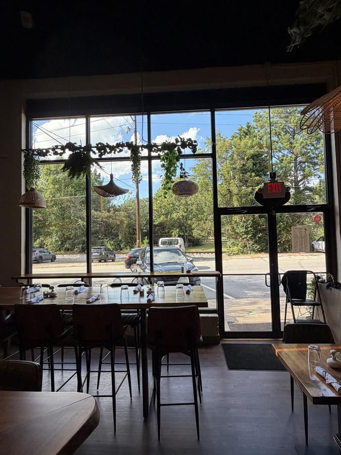Restaurant dining room looking out through clean full-height windows